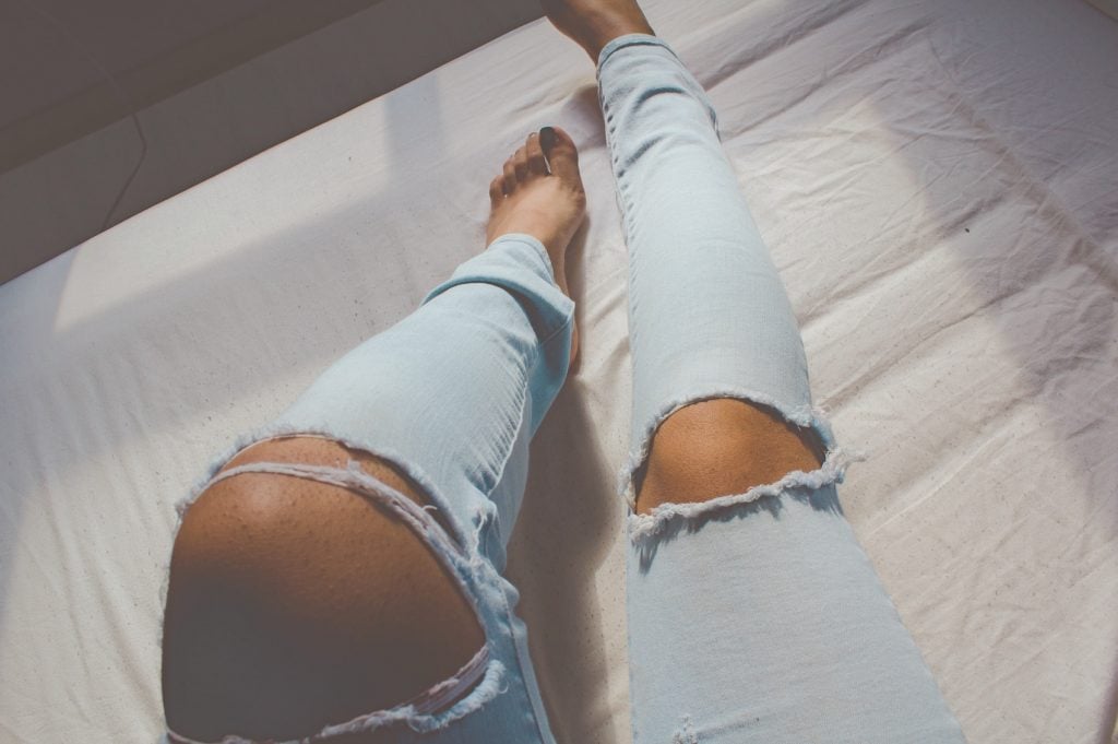 Woman in Ripped Jeans